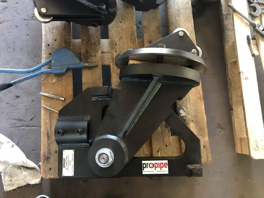 Propipe line stop pivot head displayed on a wooden pallet in a workshop setting