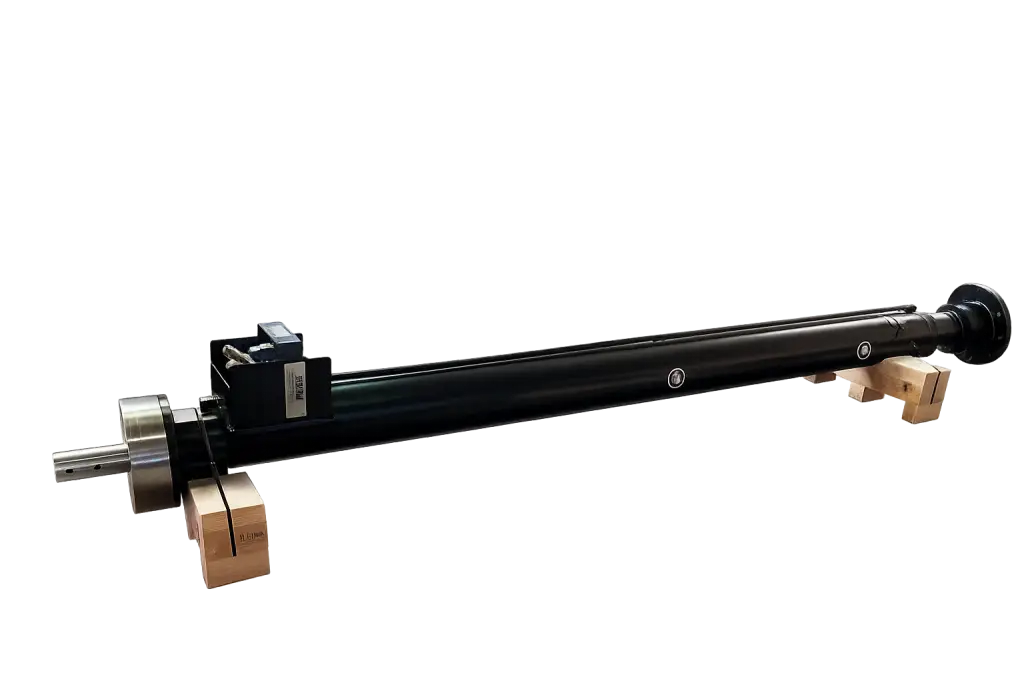 Industrial-grade Propipe ACTUATOR III hydraulic cylinder displayed on wooden support blocks in a workshop setting
