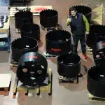 Equipment for Live Pipeline Intervention 19 Hot tap cutter displayed in an industrial setting, featuring a circular cutting head with reinforced blades