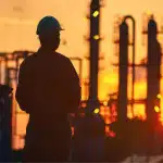 Equipment for Live Pipeline Intervention 2 Two factory technicians in safety gear reviewing schematics and coordinating line stop procedures in an industrial workshop